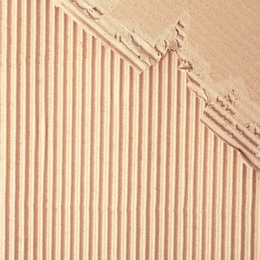 Wall paper design. Brown corrugated sheet of cardboard as background