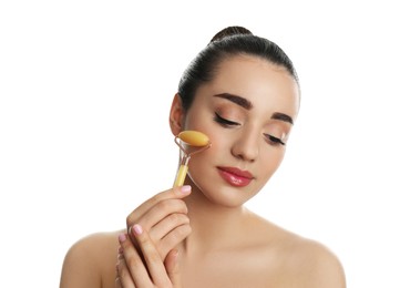 Photo of Woman using natural jade face roller on white background