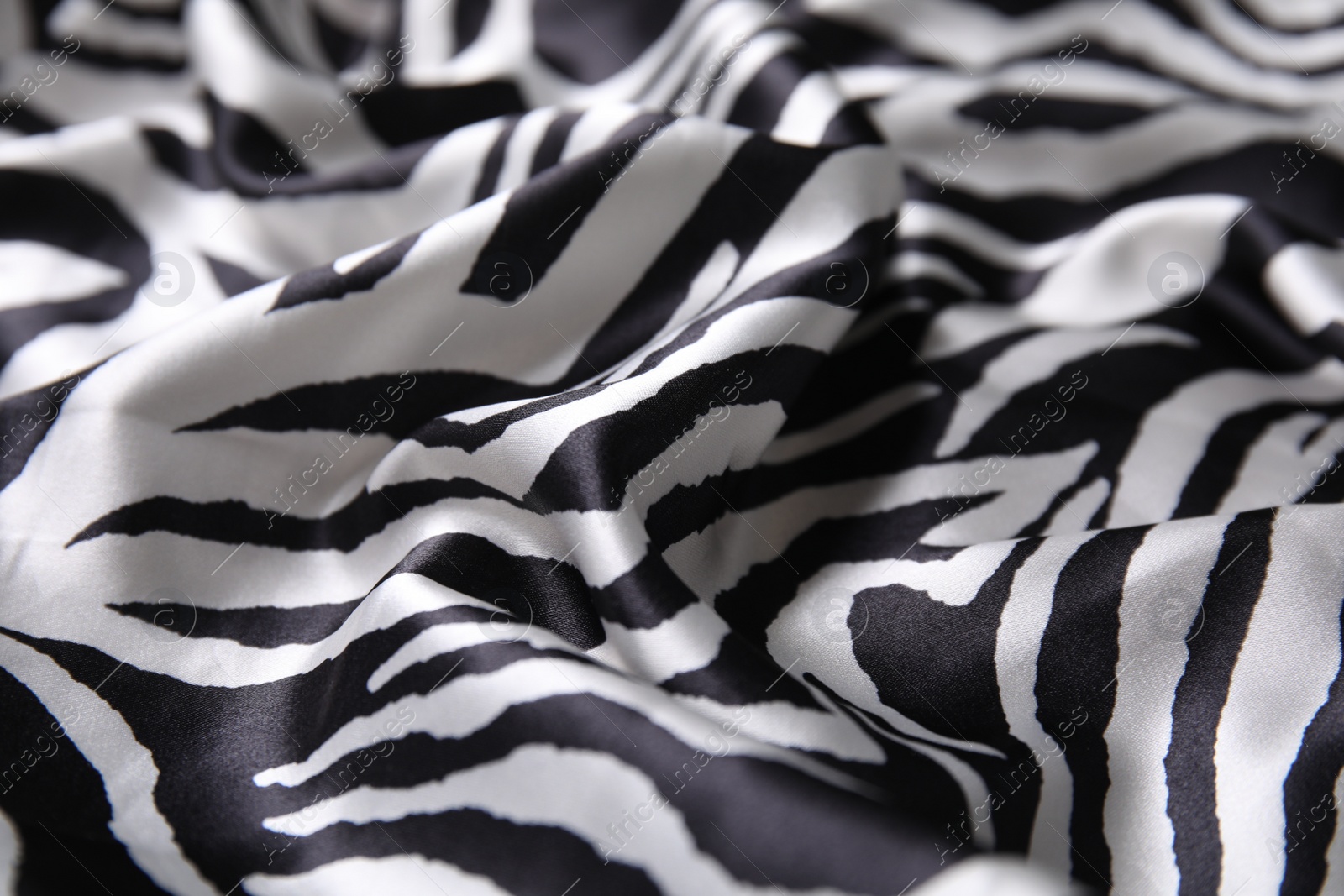 Photo of Texture of beautiful fabric with animal pattern as background, closeup
