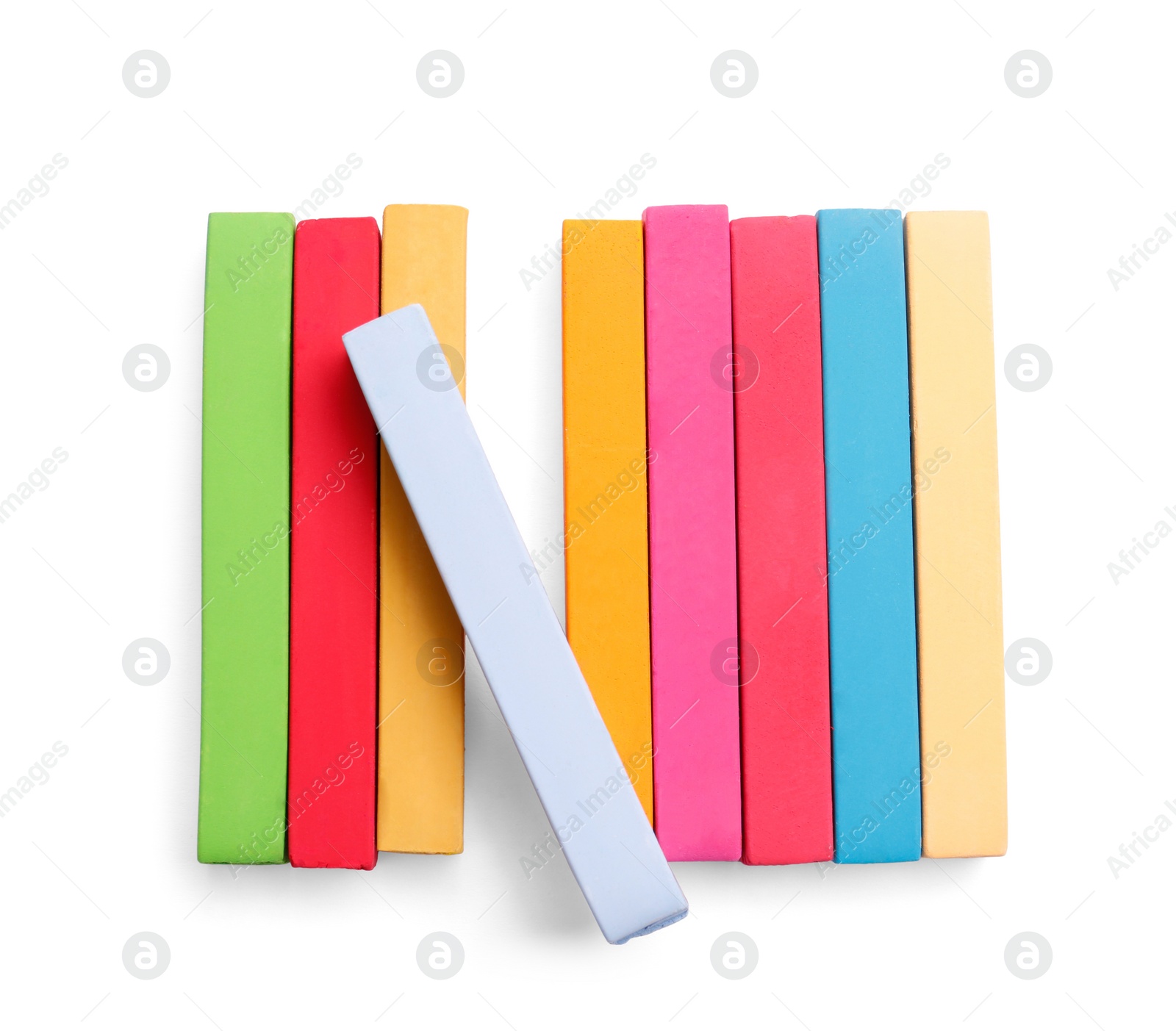 Photo of Colorful pastels on white background, top view. Drawing materials