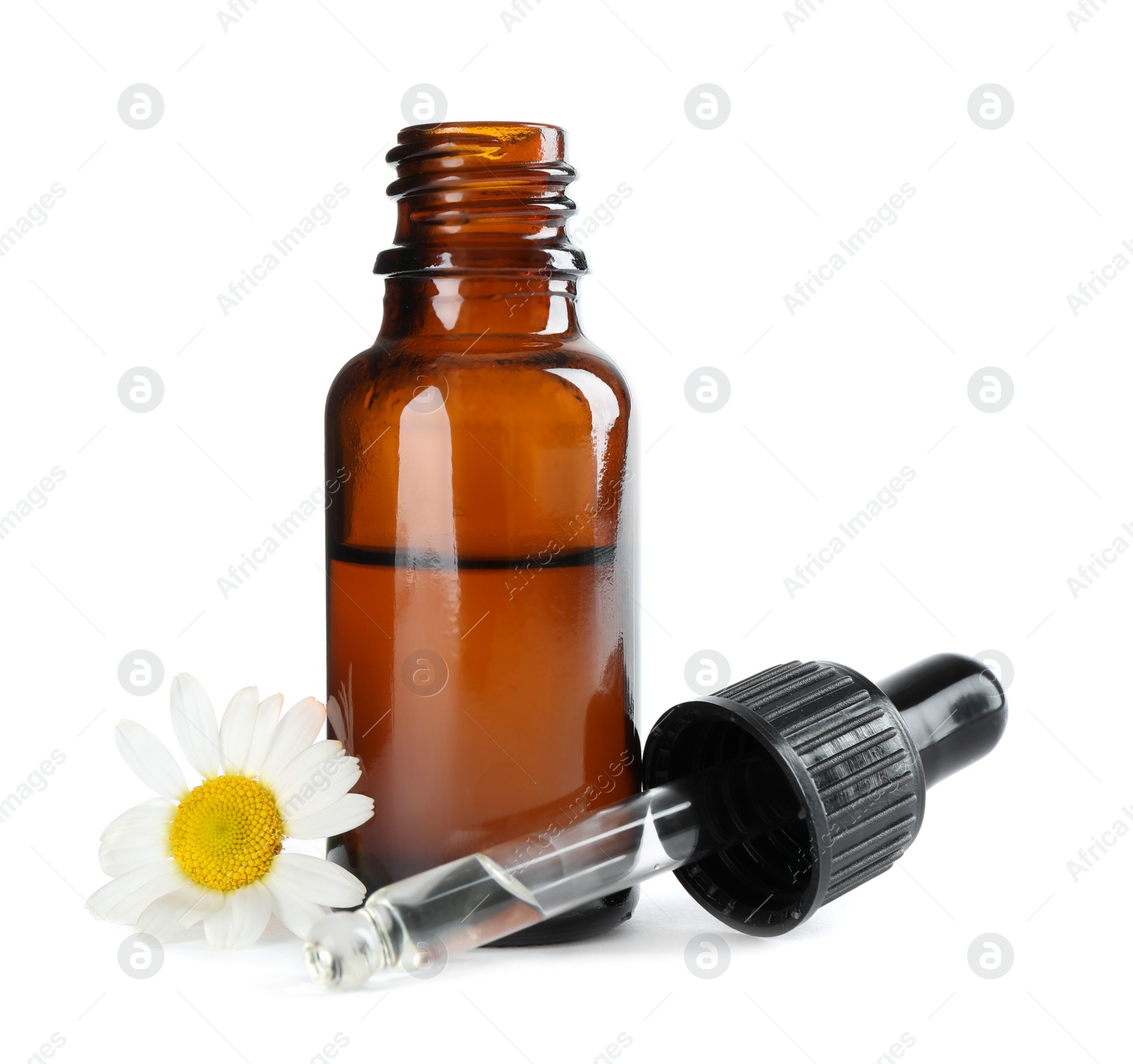 Photo of Bottle of herbal essential oil, pipette and chamomile flower isolated on white