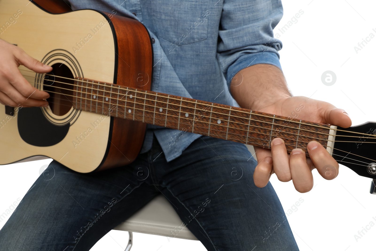 Photo of Man playing guitar on white background, closeup. Music teacher