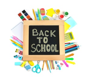 Chalkboard with phrase "BACK TO SCHOOL" and different stationery on white background, top view