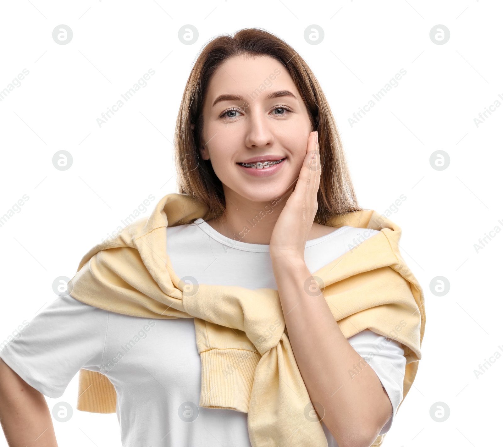 Photo of Portrait of smiling woman with dental braces on white background