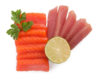Delicious sashimi set of salmon and tuna served with lime and parsley isolated on white, top view