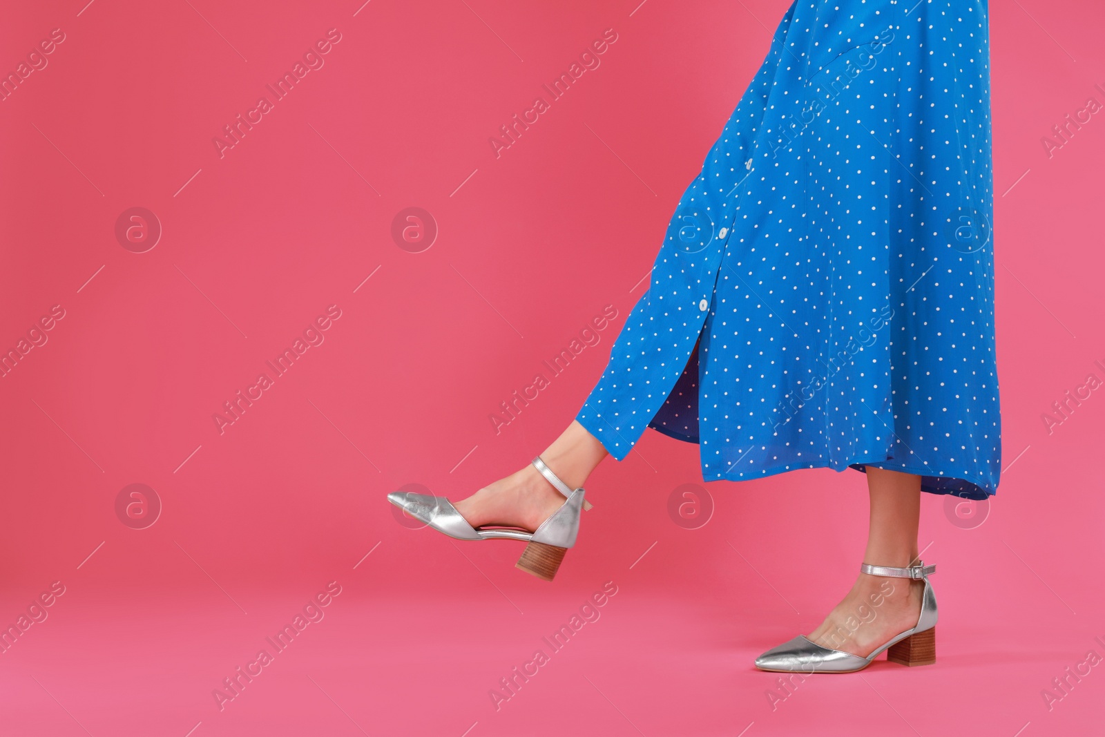 Photo of Woman in stylish shoes on pink background. Space for text