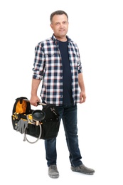 Mature plumber with tool bag on white background