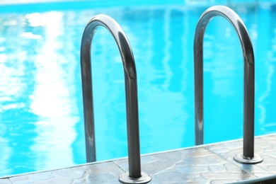 Photo of Modern swimming pool with stairs at resort