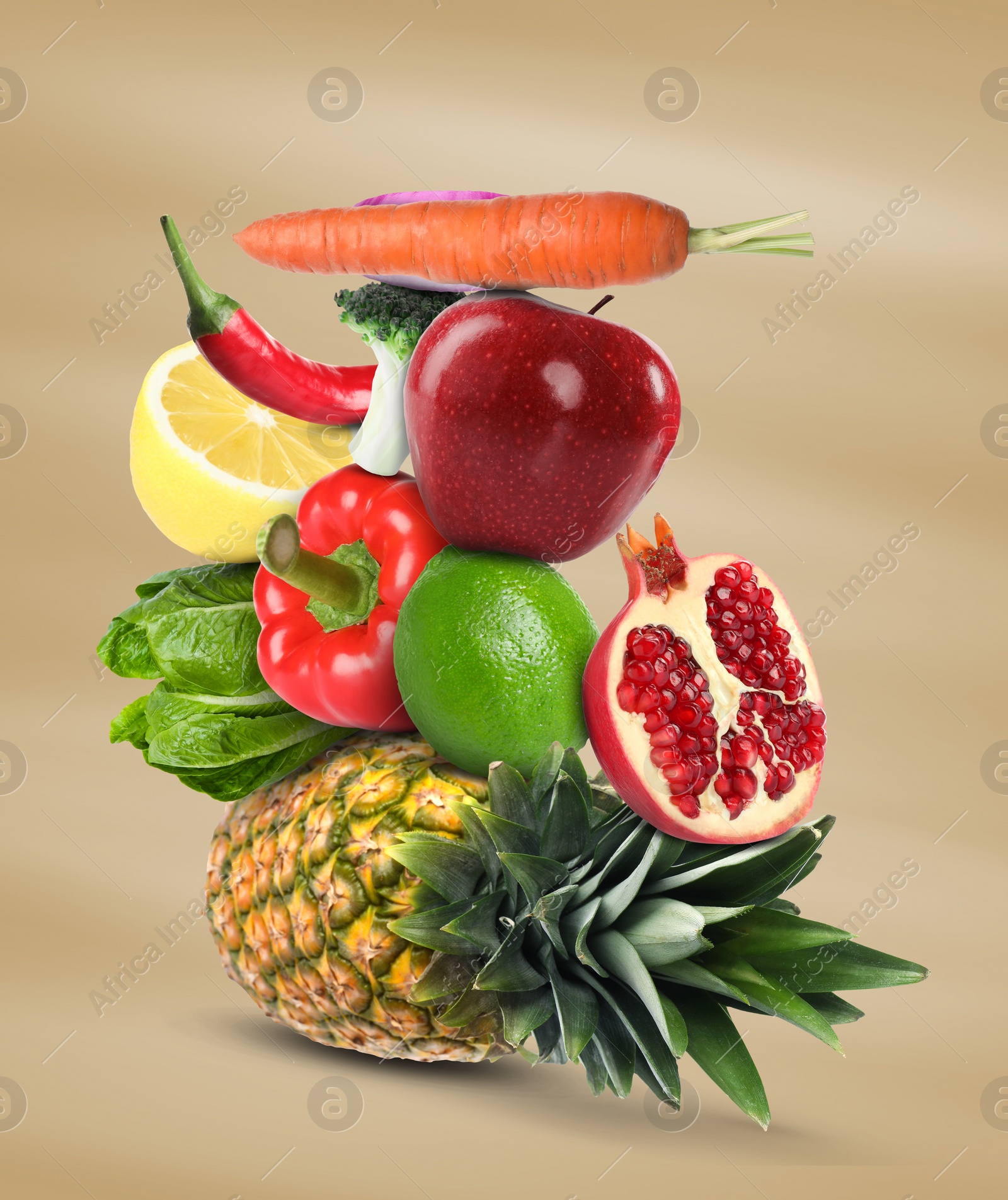 Image of Stack of different vegetables and fruits on pale light brown background