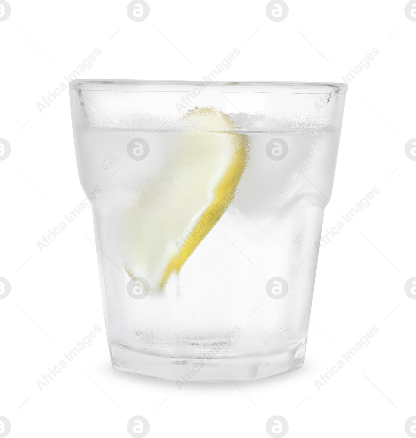 Photo of Glass of vodka with ice and lemon isolated on white