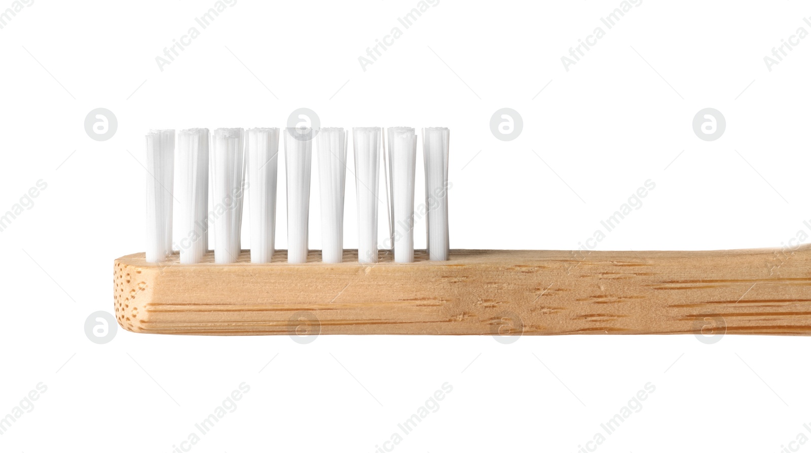 Photo of Toothbrush made of bamboo on white background, closeup