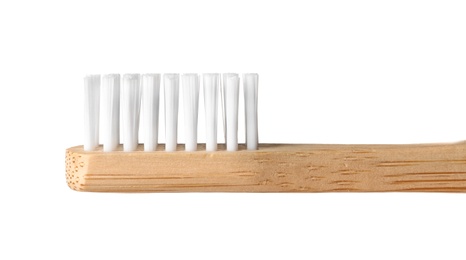 Toothbrush made of bamboo on white background, closeup