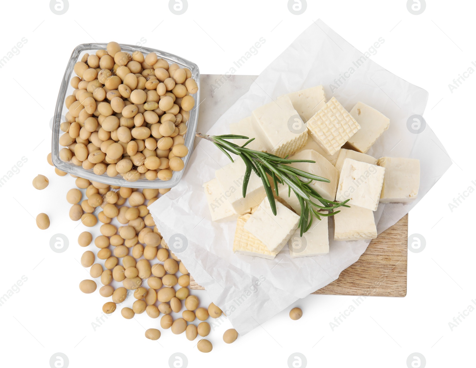 Photo of Delicious tofu cheese, rosemary and soybeans isolated on white, top view