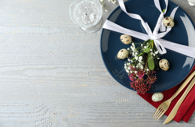 Photo of Festive Easter table setting with beautiful floral decor, flat lay. Space for text