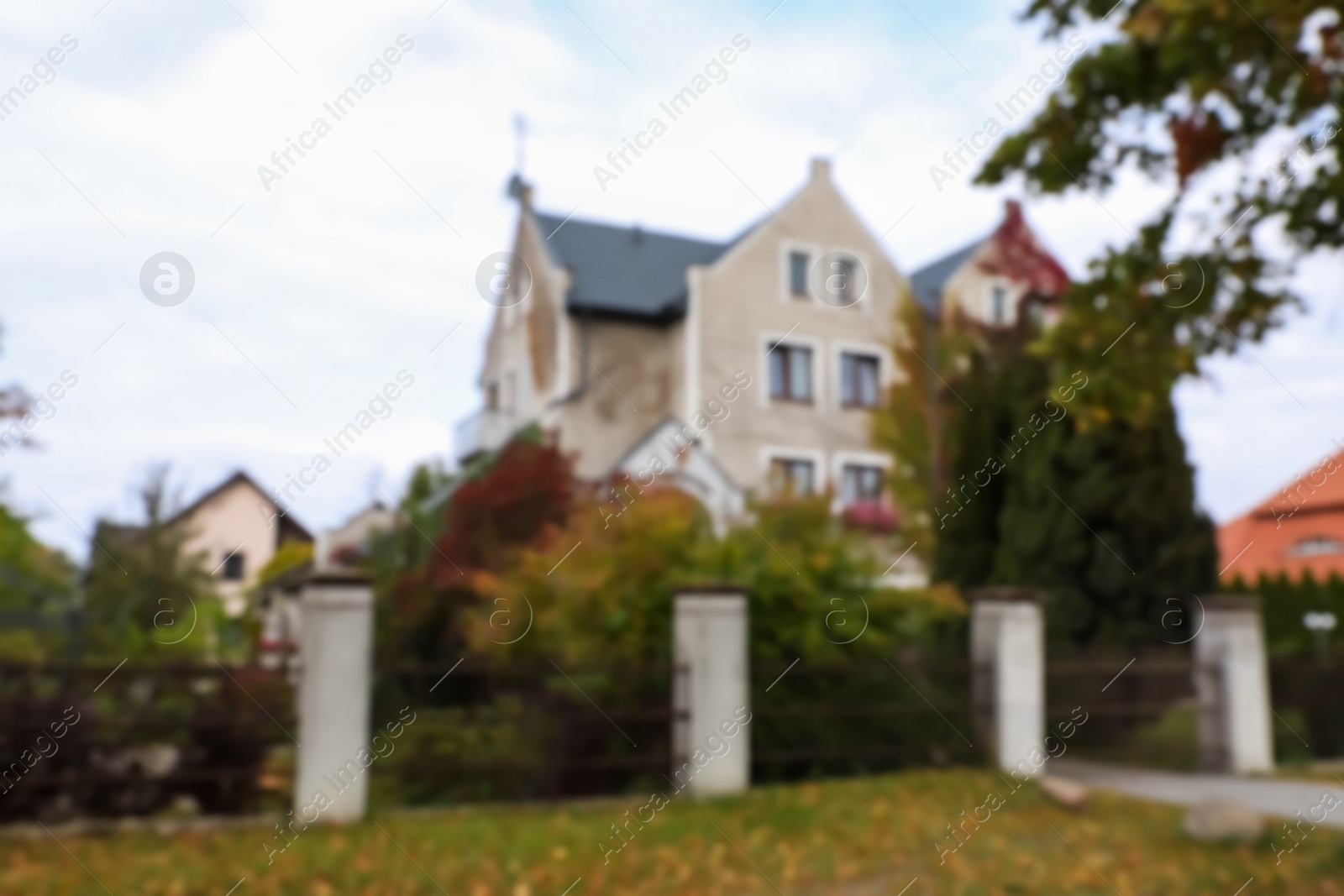 Photo of Blurred view of beautiful stylish house outdoors. Real estate for rent