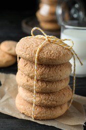 Delicious sugar cookies on black wooden table, closeup