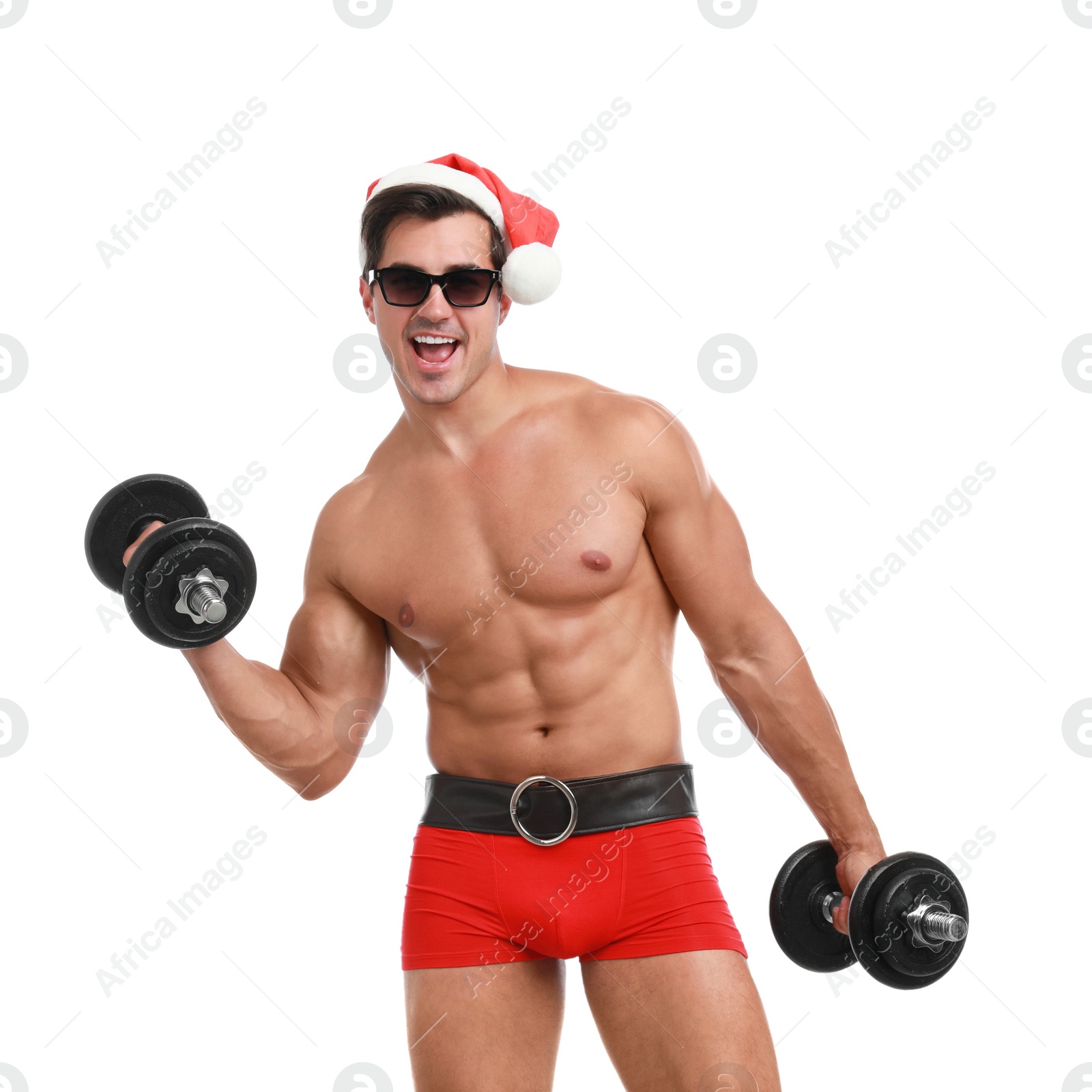 Photo of Sexy shirtless Santa Claus with dumbbells on white background