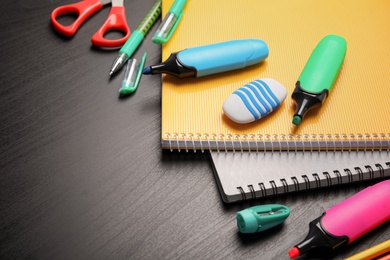 Photo of Different stationery on wooden table. Back to school