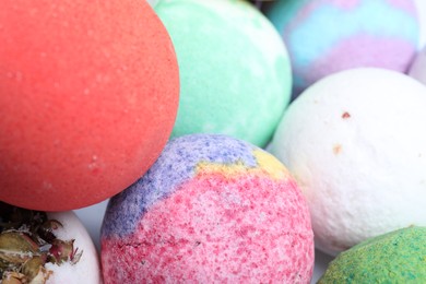 Photo of Colorful bath bombs as background, closeup view
