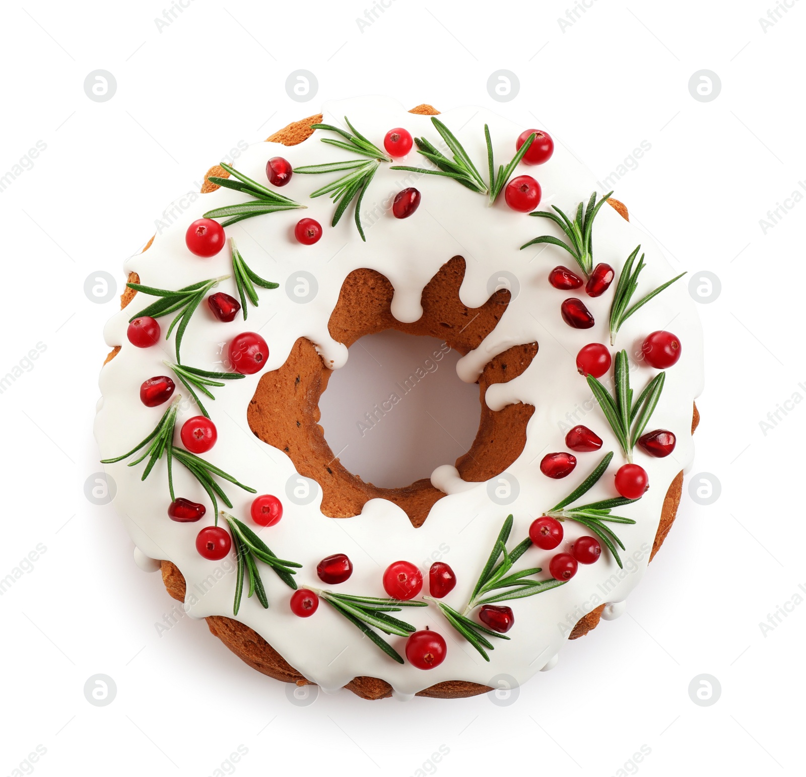 Photo of Traditional Christmas cake decorated with glaze, pomegranate seeds, cranberries and rosemary isolated on white, top view