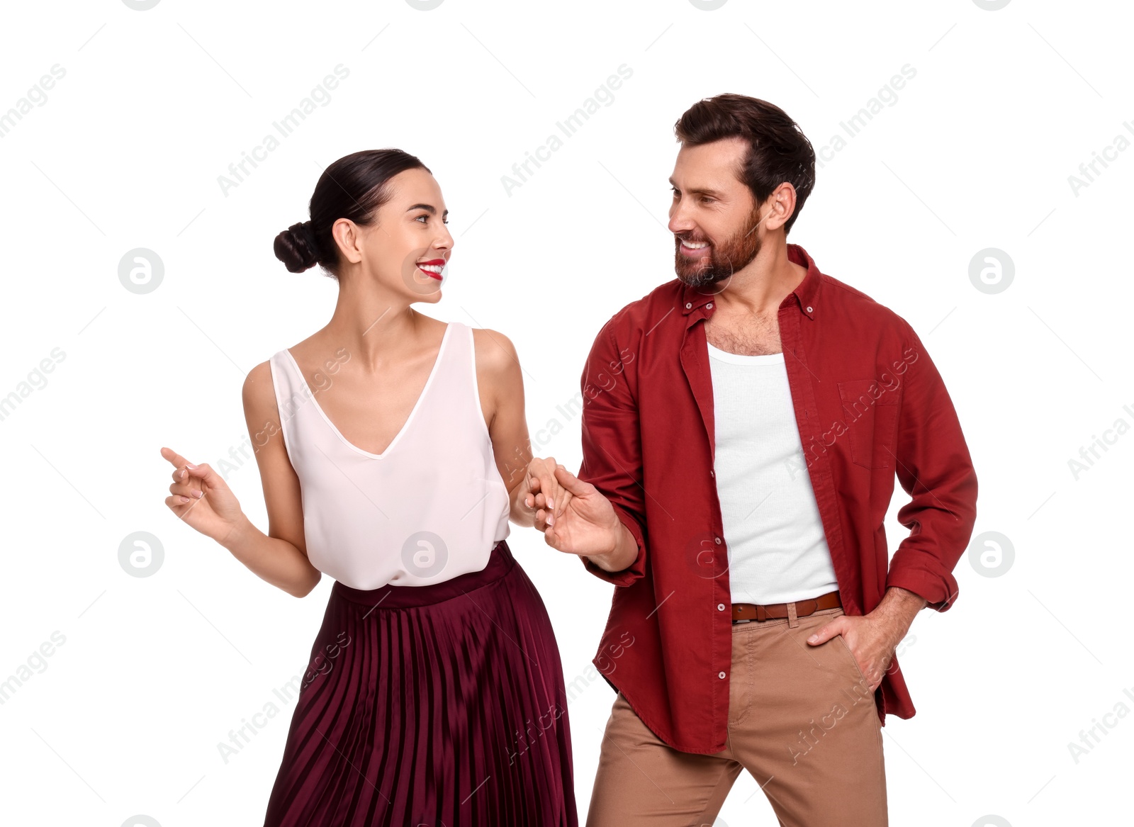 Photo of Happy couple dancing together on white background