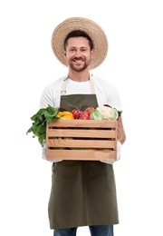 Photo of Harvesting season. Happy farmer holding wooden crate with vegetables on white background