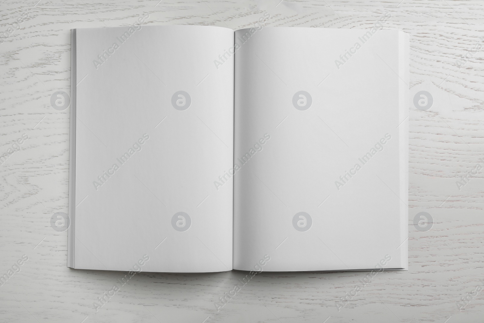 Photo of Mockup of open blank brochure on white background, top view