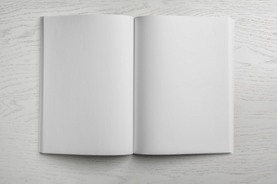 Photo of Mockup of open blank brochure on white background, top view