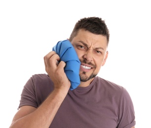 Man suffering from toothache on white background