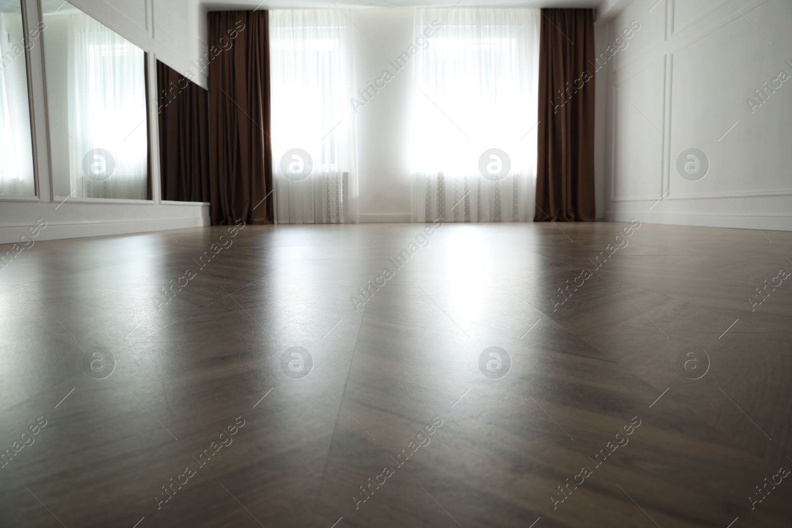 Photo of Parquet floor in light spacious empty room