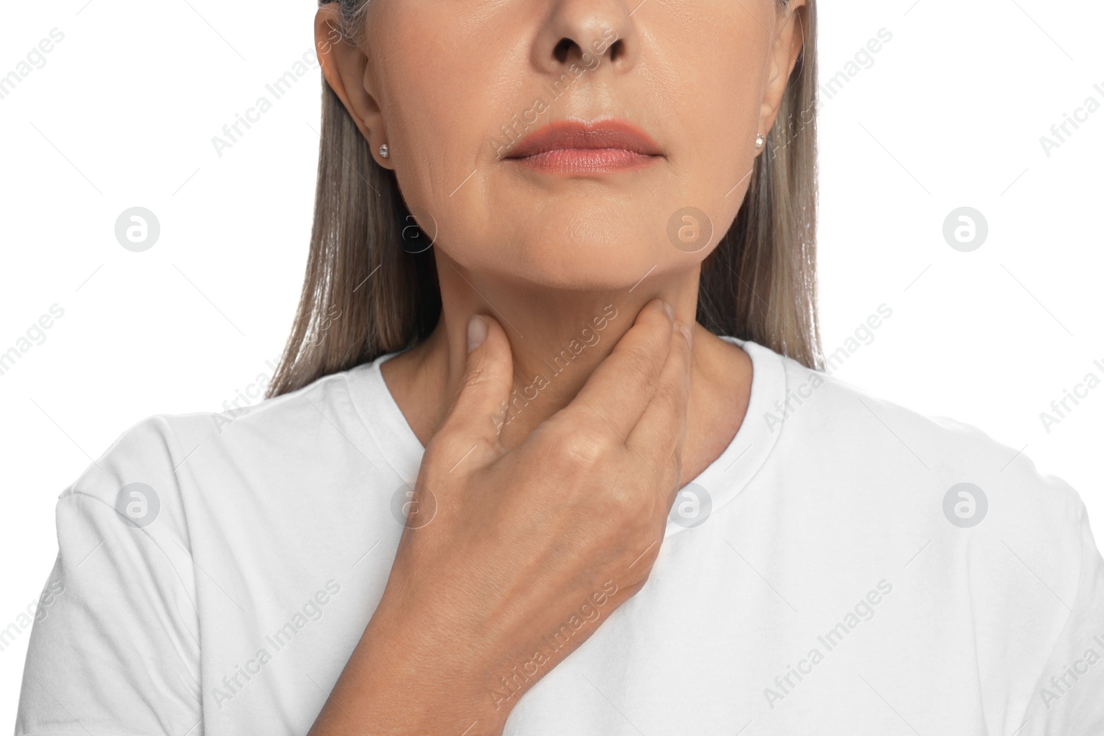 Photo of Endocrine system. Senior woman doing thyroid self examination on white background, closeup