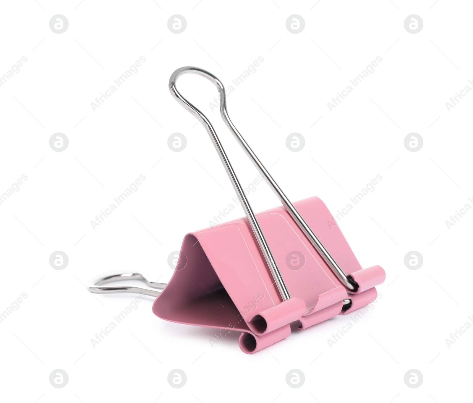 Photo of Pink binder clip isolated on white. Stationery item