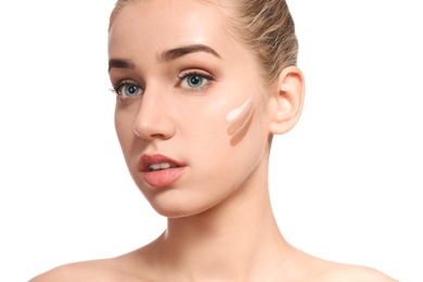 Photo of Young woman with different shades of skin foundation on her face against white background. Professional makeup