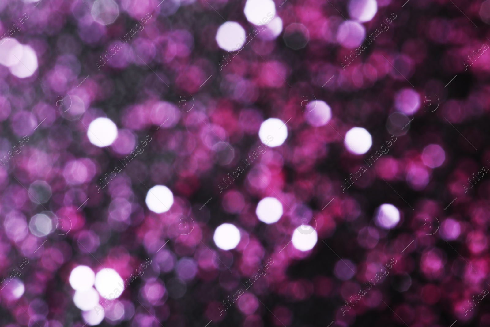 Photo of Magic pink bokeh effect on dark background