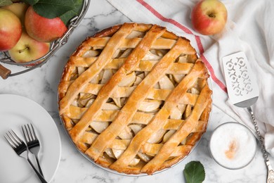 Photo of Delicious traditional apple pie on white marble table, flat lay
