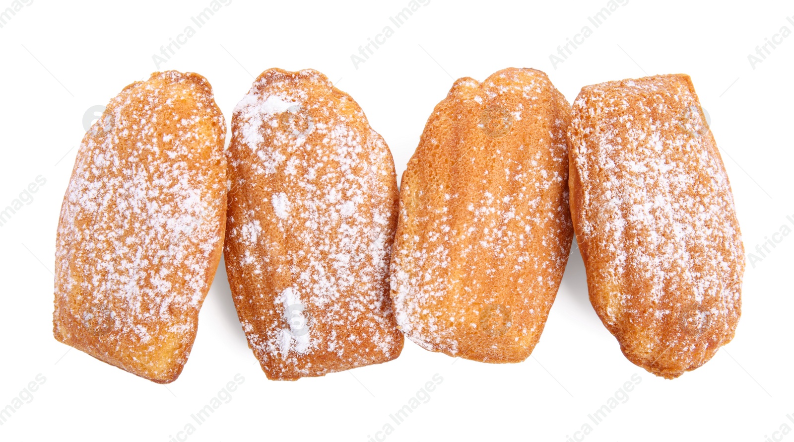 Photo of Delicious madeleine cakes with powdered sugar on white background, top view