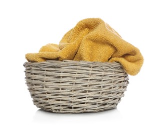 Towel in wicker basket on white background