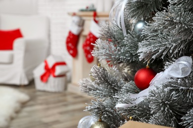 Photo of Beautiful decorated Christmas tree in living room
