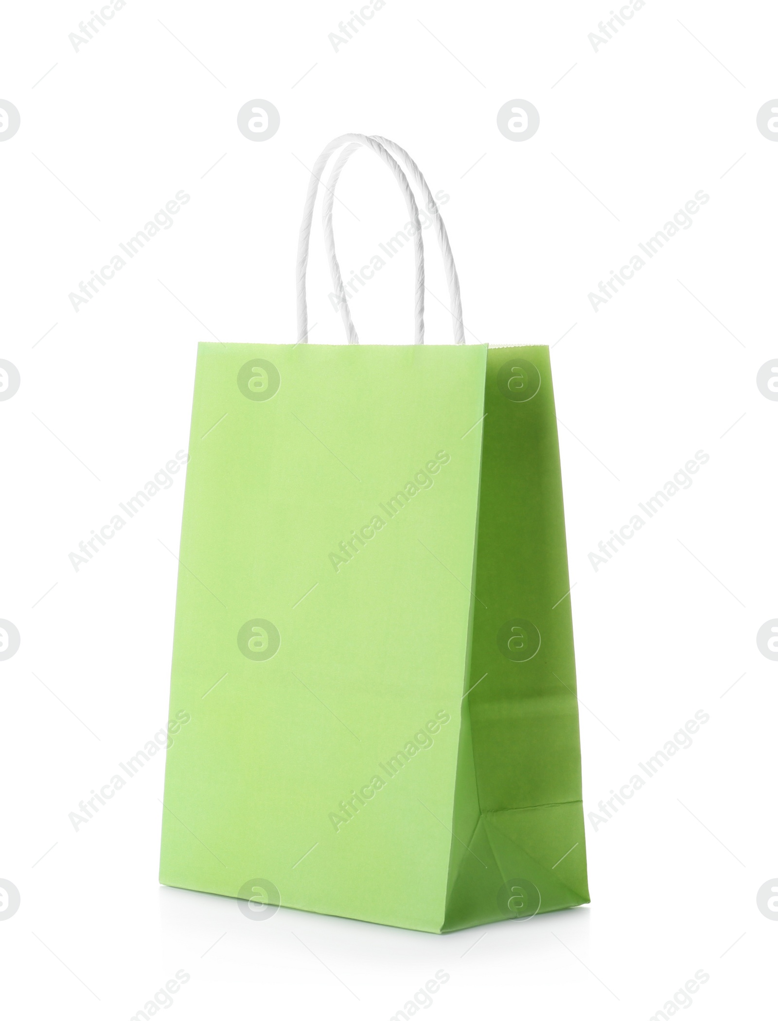 Photo of Mockup of paper shopping bag on white background