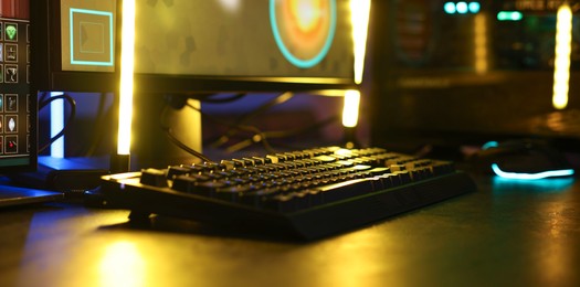 Playing video games. Computer keyboard on table