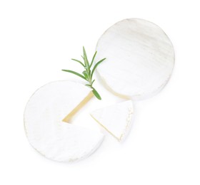 Photo of Tasty cut and whole brie cheeses with rosemary on white background, top view