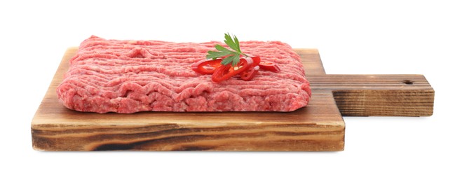 Photo of Board with raw ground meat, chili pepper and parsley isolated on white