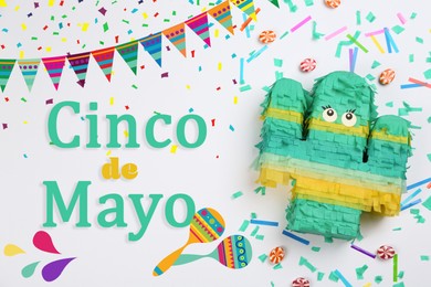 Image of Cinco de Mayo festive poster. Bright funny pinata on light background, flat lay