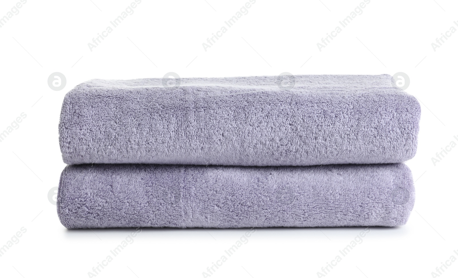 Photo of Fresh soft folded towels isolated on white