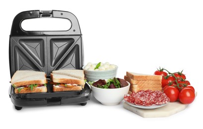 Modern grill maker with sandwiches and different products on white background