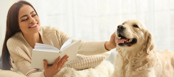 Image of Young woman with book and her pet at home. Banner design