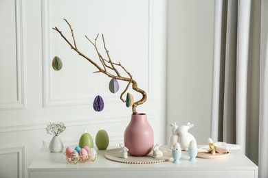 Photo of Beautiful festive composition with Easter decor on white table indoors