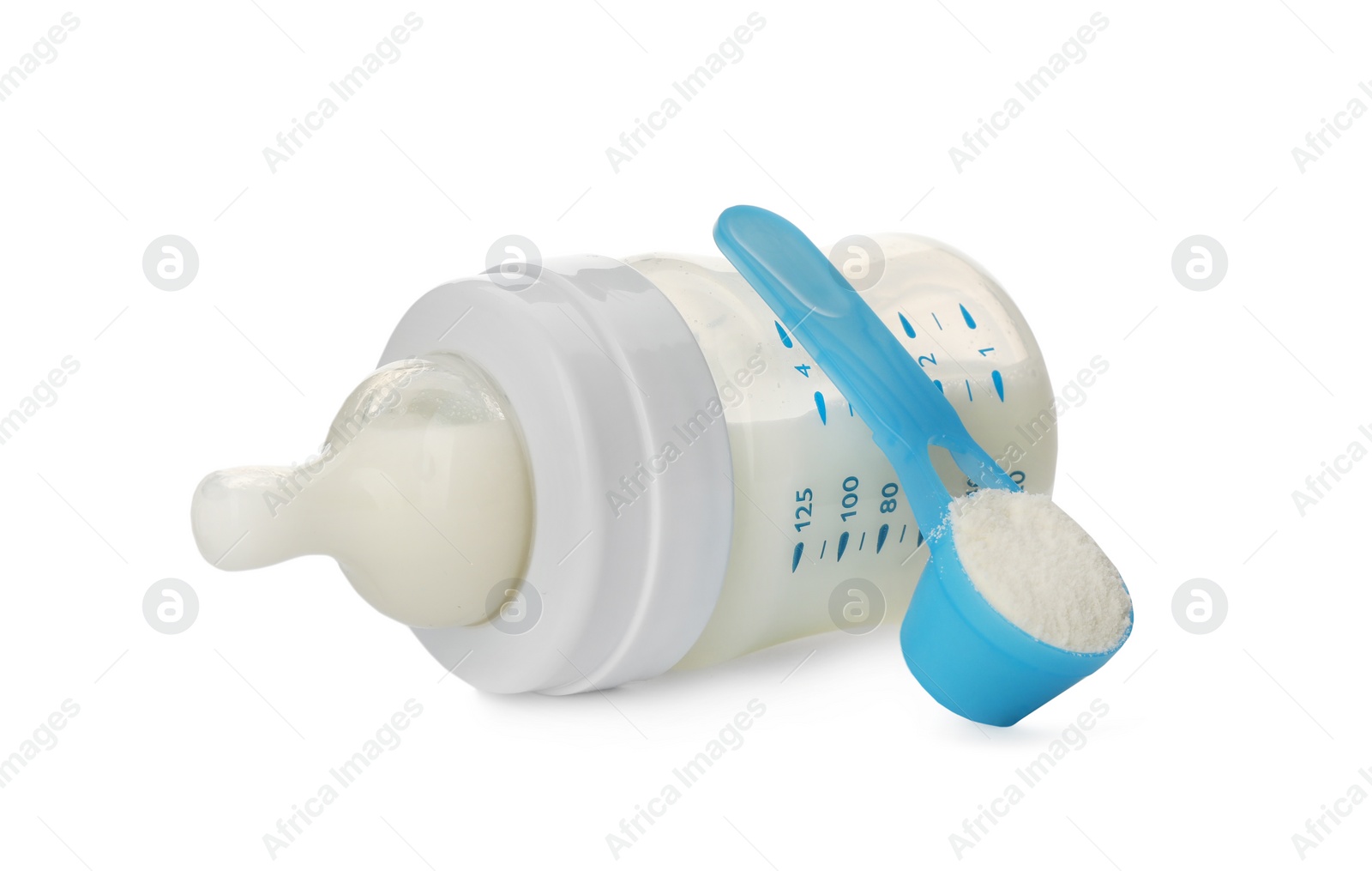 Photo of Feeding bottle with infant formula and scoop of powder on white background. Baby milk