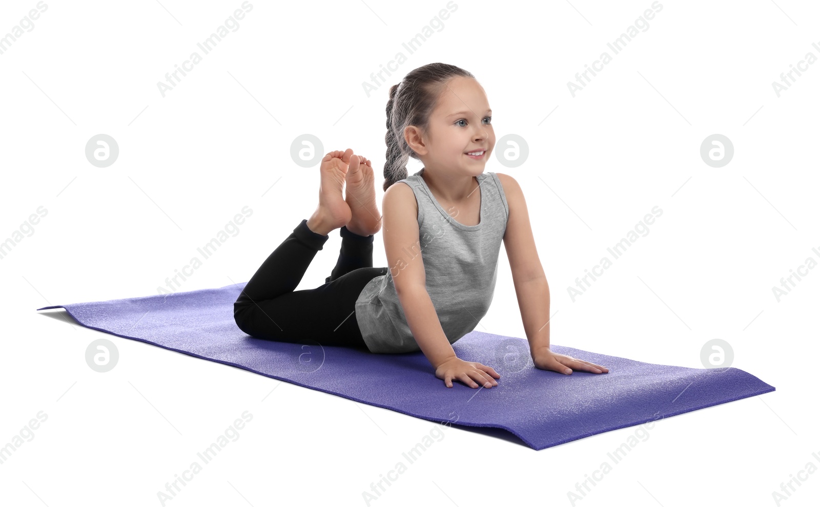 Photo of Cute little girl stretching on white background