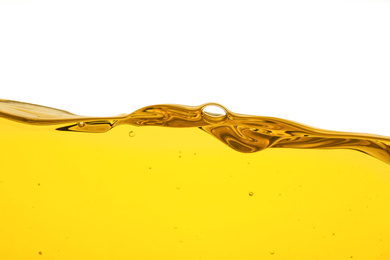 Photo of Cooking oil flow isolated on white. Color liquid